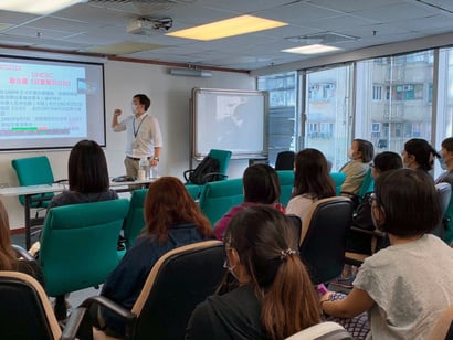 Professor Wearing Face Mask Presenting in a Classroom